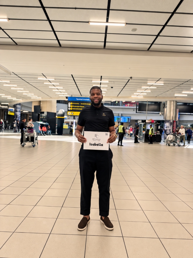 Professional Ditlhalefi chauffeur holding a name board at arrivals